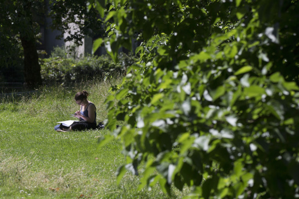 Members of the Public Relax in the Warm Weather in London