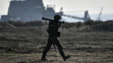 Russian serviceman takes part in an amphibious assault exercise along the coast held by army corps and naval infantry units of the Russian Black Sea Fleet at the Opuk training ground near Kerch, Crimea