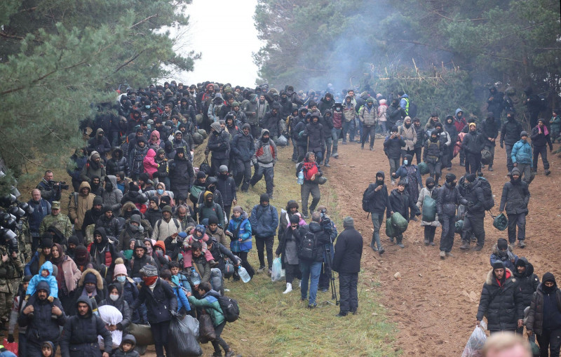 Grodno Region, Belarus. 15th Nov, 2021. Migrants by the Bruzgi - Kuznica checkpoint on the Belarusian-Polish border. The migrant crisis on the border of Belarus with Poland, Lithuania, and Latvia escalated on November 8. Several thousand migrants approach