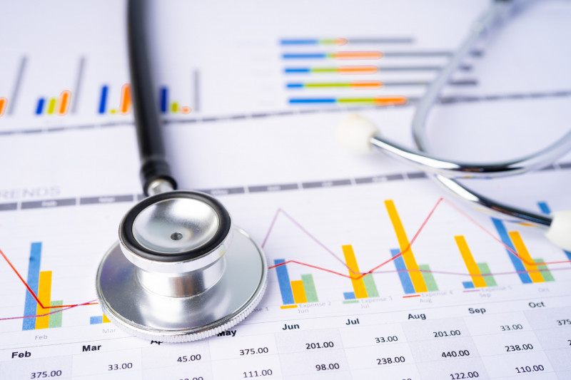 Stethoscope on graphs paper, Finance, Account, Statistics, Investment, Analytic data economy and Business company concept.