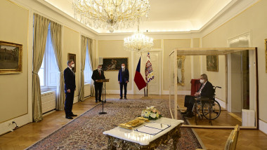 Covid-struck Czech President Milos Zeman, sits in a plastic cage as he appoints ODS leader Petr Fiala (L) as Czech Prime Minister at the Lany manor, near Prague, on November 28, 2021