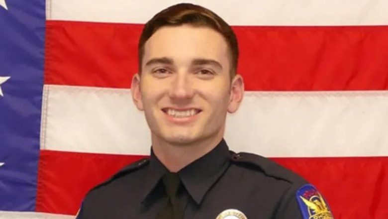 Tyler Moldovan, 22 de ani, polițist de origine română în SUA, in uniforma, zambeste