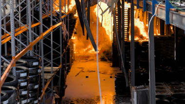 Inside one of the warehouses, the fire reaches the tyres stored there