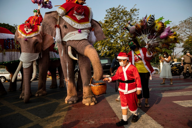 Elephant Santas Deliver Presents To Schoolchildren