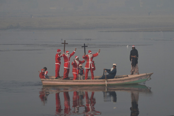 Pakistani members of Bright Future Society and IMRF wearing costumes of Santa Clause, Lahore, Punjab, Pakistan - 24 Dec 2021