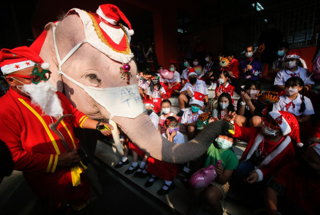 Elephant Santas pass out face masks, hand gel at Jirasartwitthaya school in Thailand - 24 Dec 2021