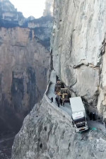 Truck dangles from 330ft cliff after GPS takes him on narrow mountain road in China