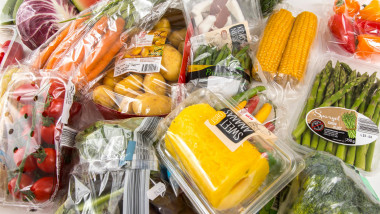 Fresh food, vegetables, fruit, each individually packaged in plastic wrap, all food is available in the same supermarket even without plastic packagin