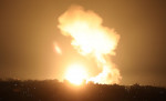 Smoke and fireball rises following an air strike in Khan Yunis in the southern Gaza Strip, Khan Yunis, Gaza Strip, Palestinian Territory - 01 Jan 2022