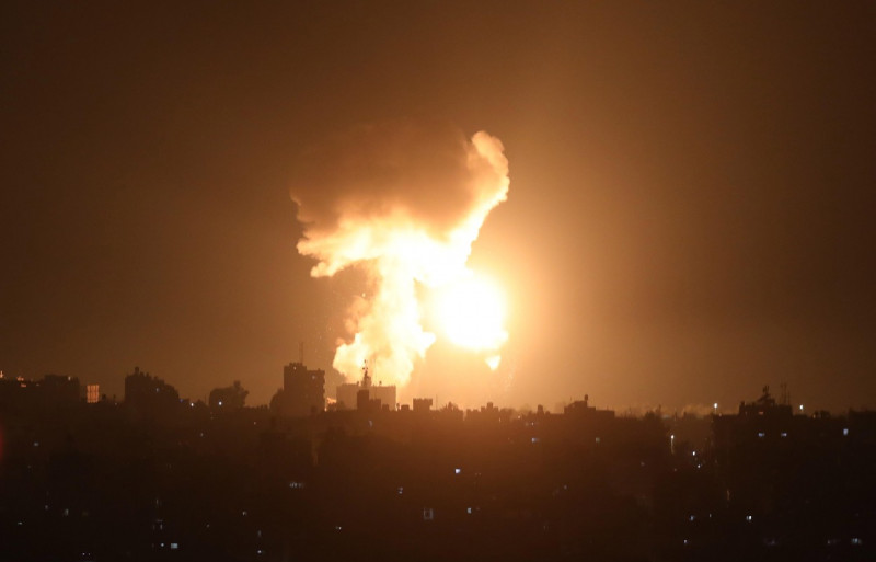 Smoke and fireball rises following an air strike in Khan Yunis in the southern Gaza Strip, Khan Yunis, Gaza Strip, Palestinian Territory - 01 Jan 2022