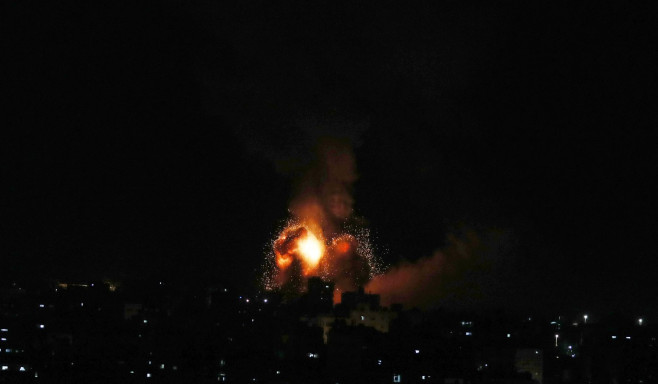 Smoke and fireball rises following an air strike in Khan Yunis in the southern Gaza Strip, Khan Yunis, Gaza Strip, Palestinian Territory - 01 Jan 2022