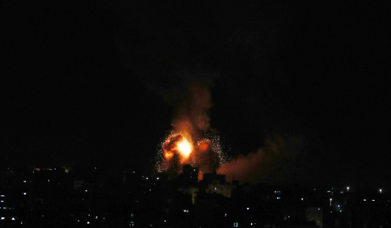 Smoke and fireball rises following an air strike in Khan Yunis in the southern Gaza Strip, Khan Yunis, Gaza Strip, Palestinian Territory - 01 Jan 2022