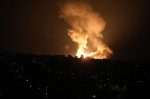 Smoke and fireball rises following an air strike in Khan Yunis in the southern Gaza Strip, Khan Yunis, Gaza Strip, Palestinian Territory - 01 Jan 2022