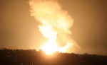 Smoke and fireball rises following an air strike in Khan Yunis in the southern Gaza Strip, Khan Yunis, Gaza Strip, Palestinian Territory - 01 Jan 2022