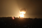 Smoke and fireball rises following an air strike in Khan Yunis in the southern Gaza Strip, Khan Yunis, Gaza Strip, Palestinian Territory - 01 Jan 2022