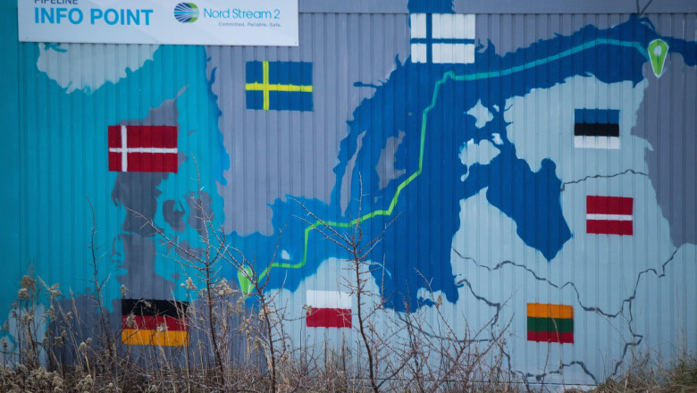 Lubmin, Germany. 07th Jan, 2022. A sign reading "Nord Stream 2 Committed Reliable Safe" hangs above a painted map at an information point on the Nord Stream 2 gas pipeline in the Lubmin industrial park. The pipeline for natural gas from Russia was origina