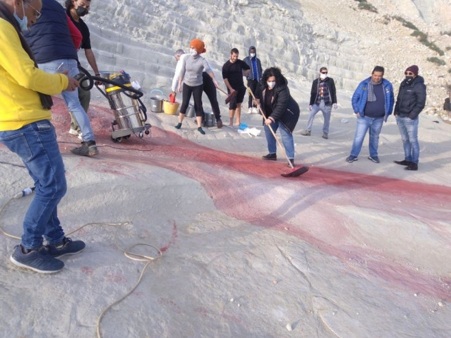 Volunteers clean up the 'Scala dei Turchi' smeared by unknown persons