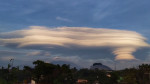 Rare UFO clouds form over mountains in Indonesia