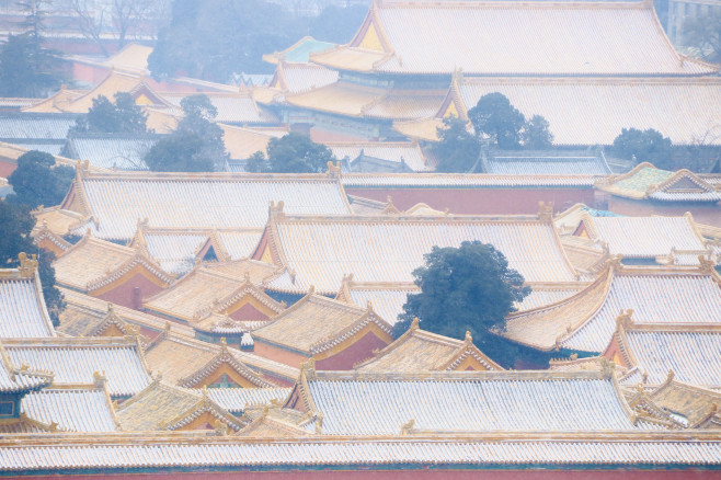 In the cold season, Beijing welcomes the first snow in 2022. The Forbidden City buildings are wrapped in silver and plain, and the scenery is charming, China - 20 Jan 2022