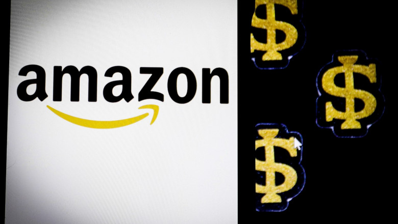 sigla amazon cu simboluri de dolar in aur