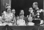 Queen Elizabeth II gestures as her husband Duke of Edinburgh Prince Phillip and children Prince Charles and Princess Anne watch the Royal Air Force flypast salute from the balcony of Buckingham Palace 2 Junne 1953