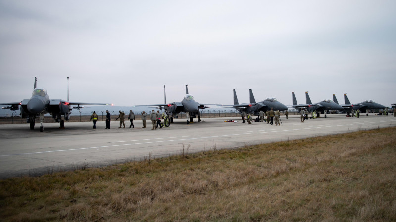 F-15E Strike Eagles with the 336th Fighter Squadron park on the ramp at Campia Turzii, Romania, in support of NATO Enhanced Air Policing mission, Dec. 15, 2021 Campia Turzii, Romania, in support of NATO Enhanced Air Policing, Dec. 15, 2021. U.S. European