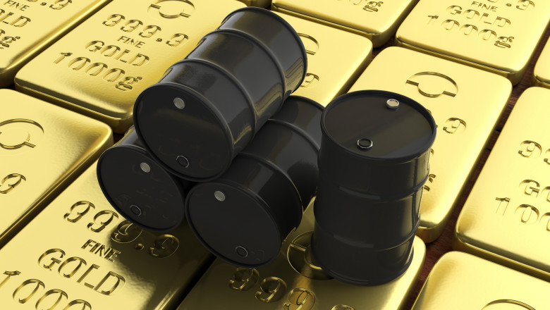 Oil barrels on gold bullions background. 3d illustration