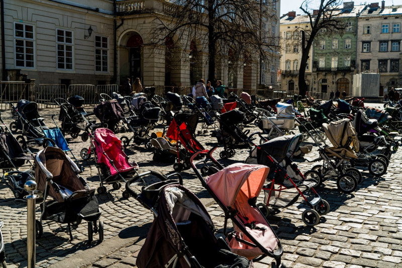 Strollers seen in Rynok Square in memory and honour of the 109 children killed by the war in Ukraine - 18 Mar 2022