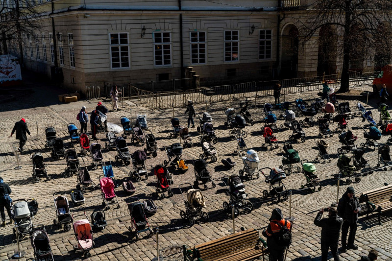 Strollers seen in Rynok Square in memory and honour of the 109 children killed by the war in Ukraine - 18 Mar 2022