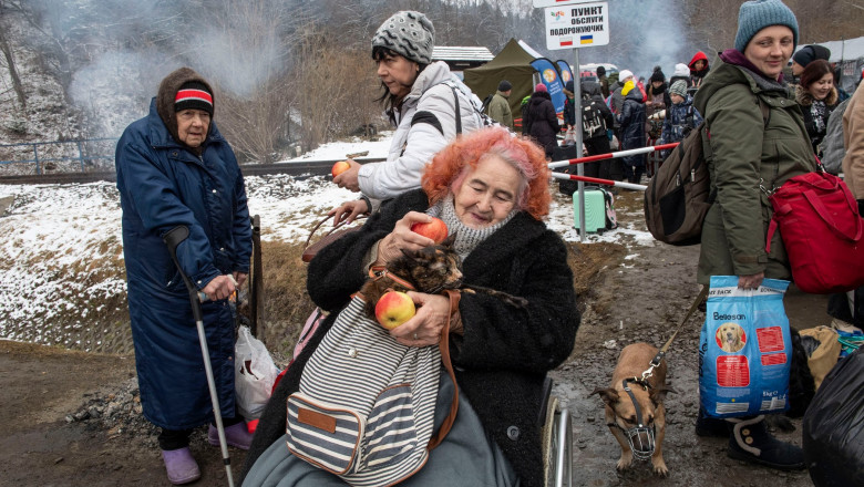 Ukrainian civilians cross the border into Poland
