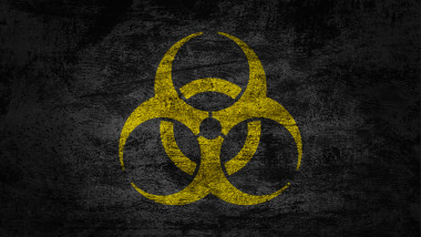 Biohazard warning sign on dark background