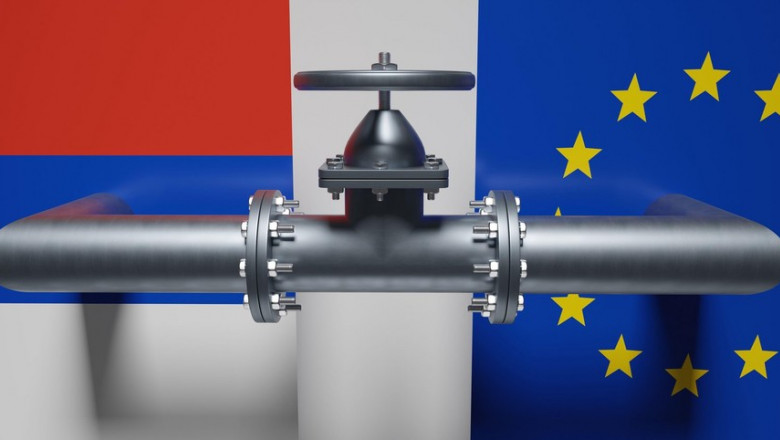 Natural gas transportation in Europe, Gas pipe and valve wheel, Russian and European Union flag background. 3d renderw