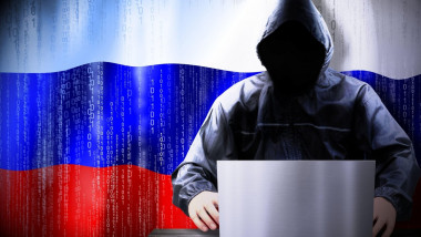 Anonymous hooded hacker, flag of Russia, binary code - cyber attack concept