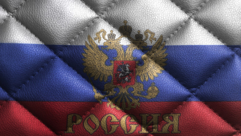 Flag of the Russian Federation with emblem of Russia on leather texture