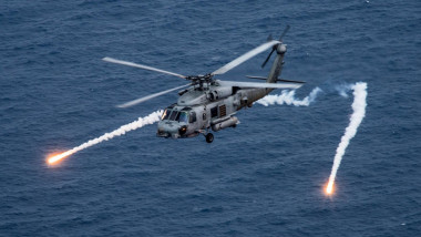 170424-N-BL637-099 PHILIPPINE SEA (April 24, 2017) An MH-60R Sea Hawk from the Helicopter Maritime Strike Squadron (HSM) 78 Blue Hawks fires chaff flares during a training exercise near the aircraft carrier USS Carl Vinson (CVN 70). U.S. Navy aircraft c