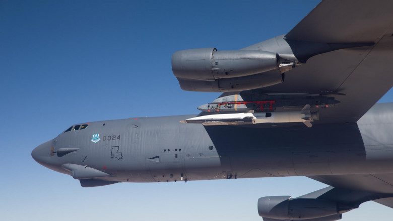 B-52 carries the X-51 Hypersonic Vehicle out to the range for launch test. May 1, 2013. Photographer: Bobbi Zapka