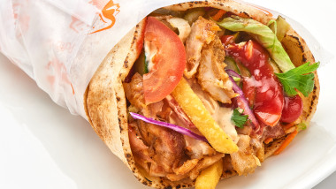 shawarma with sauce on white background