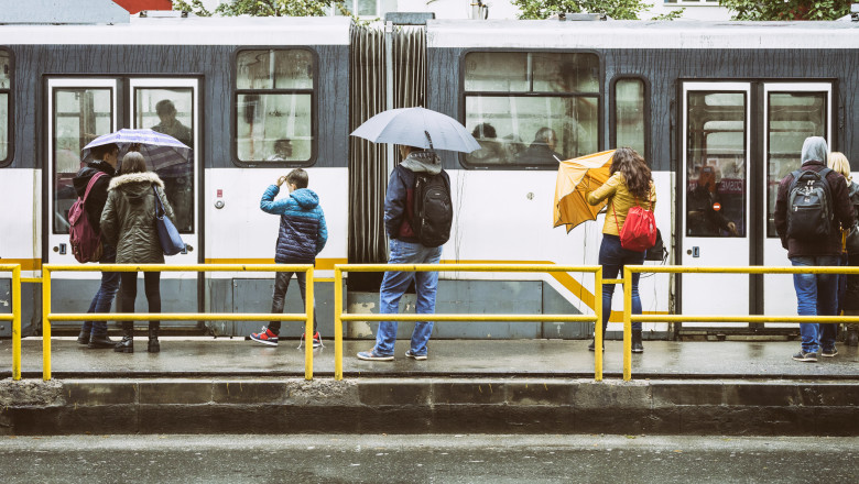 Waiting for the tram in the rain