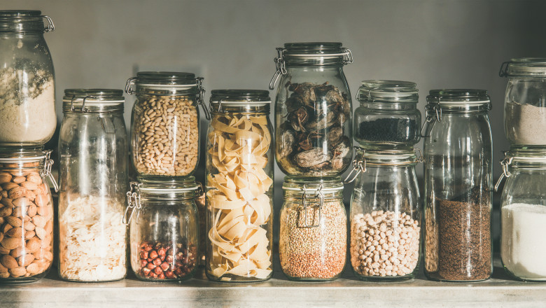 Rustic kitchen food storage arrangement in glass jars