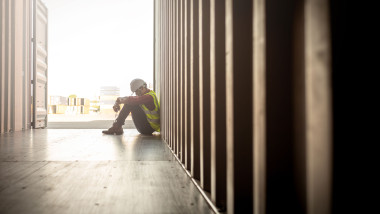 despair staff in logistic business sittng in container
