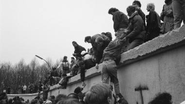East Berliners Climb Wall