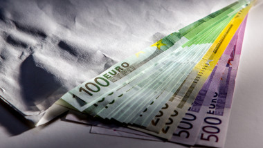 Euro cash banknotes in envelope, illegal profit concept