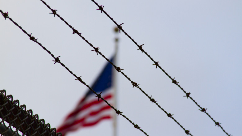American Flag Behind Barb Wire