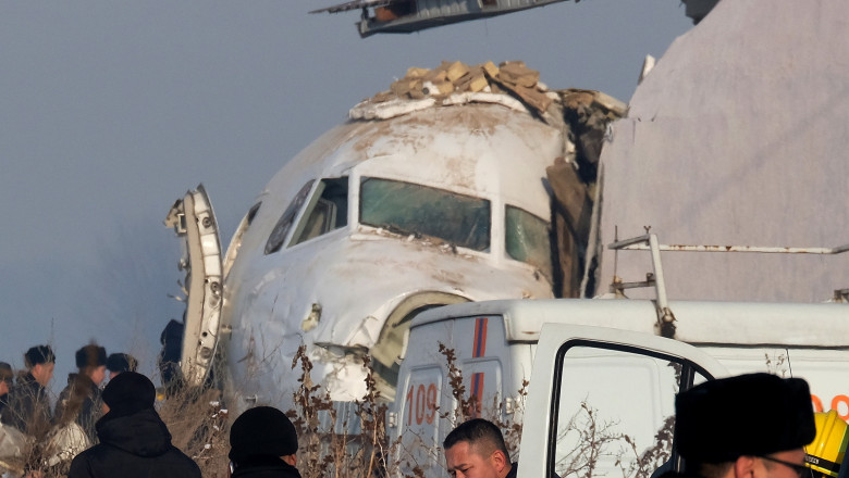 epa08091526 Rescuers work at the site of an airplane crash near Almaty airport, some 20km from the city of Almaty, Kazakhstan, 27 December 2019. According to media reports, at least 14 people have died and over 60 were injured after a Bek Air's Fokker 100 passenger plane with around 100 people on board crashed shortly after taking off from Almaty airport. The flight was en-route from Almaty, the country's largest city, to the capital Nur-Sultan. The cause of the incident is yet unknown. EPA/VLADIMIR ZAIKIN
