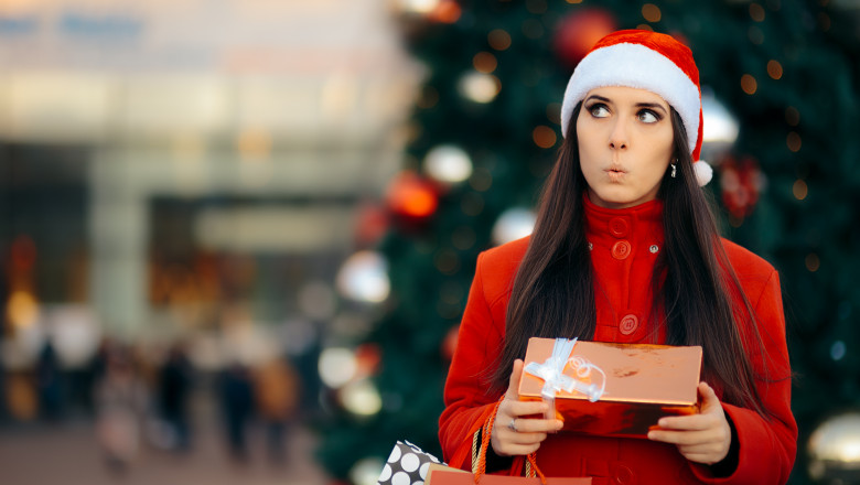 Cute woman buying presents for holiday season