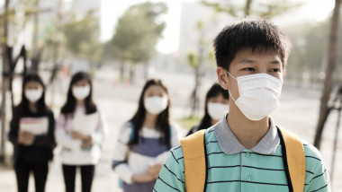 teenagers student wearing mouth mask against smog in city