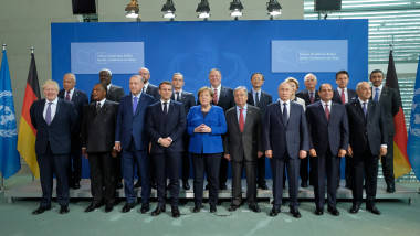 BERLIN, GERMANY - JANUARY 19: Participants, including (from L to R, first row) British Prime Minister Boris Johnson, Turkish President Recep Tayyip Erdogan (3rd from L), French President Emmanuel Macron, German Chancellor Angela Merkel, United Nations Secretary-General Antonio Guterres, Russian President Vladimir Putin and Egyptian President Abdel Fattah el-Sisi, as well as U.S. Secretary of State Mike Pompeo (C, 2nd row), and Italian Prime Minister Giuseppe Conte (2nd row, 2nd from R) pose for a group photo at an international summit on securing peace in Libya at the Chancellery on January 19, 2020 in Berlin, Germany. Leaders of nations and organizations linked to the current conflict are meeting to discuss measures towards reaching a consensus between the warring sides and ending hostilities. (Photo by Sean Gallup/Getty Images)