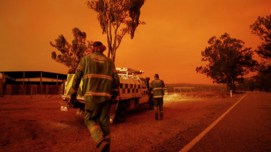 EAST GIPPSLAND, AUSTRALIA - JANUARY 04: Department of Environment, Land, Water and Planning crew get into their vehicle to respond to a call on January 04, 2020 in Double Bridges, Australia. Two people are dead and 28 remain missing following bushfires across the East Gippsland area, with Victorian premier Daniel Andrews declaring a state of disaster in the region. Thousands of people remain stranded in the coastal town of Mallacoota and are being evacuated by navy ships to Melbourne. (Photo by Darrian Traynor/Getty Images)