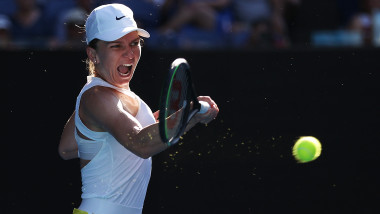 MELBOURNE, AUSTRALIA - JANUARY 30: Simona Halep of Romania plays a backhand during her Women's Singles Semifinal match against Garbine Muguruza of Spain on day eleven of the 2020 Australian Open at Melbourne Park on January 30, 2020 in Melbourne, Australia. (Photo by Clive Brunskill/Getty Images)