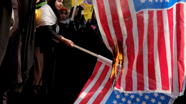 TEHRAN, IRAN - NOVEMBER 4: People burn U.S. flags a demonstration to mark the 34th anniversary of the 1979 US embassy takeover November 4, 2013 in Tehran, Iran. Thousands of Iranians packed the streets as they demonstrated to commemorate the Islamist students who stormed the embassy compound and held 52 American diplomats hostage for 444 days. (Photo by Majid Saeedi/Getty Images)